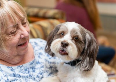Senior woman with adorable puppy